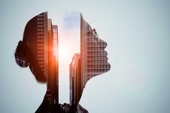 Double exposure of woman and high-rise